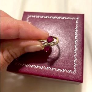 Double Natural Ruby Ring; Size 6. Adorned with diamonds, set in 14k yellow gold.
